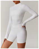 White long-sleeved athletic romper with fitted shorts for casual running fashion ملابس