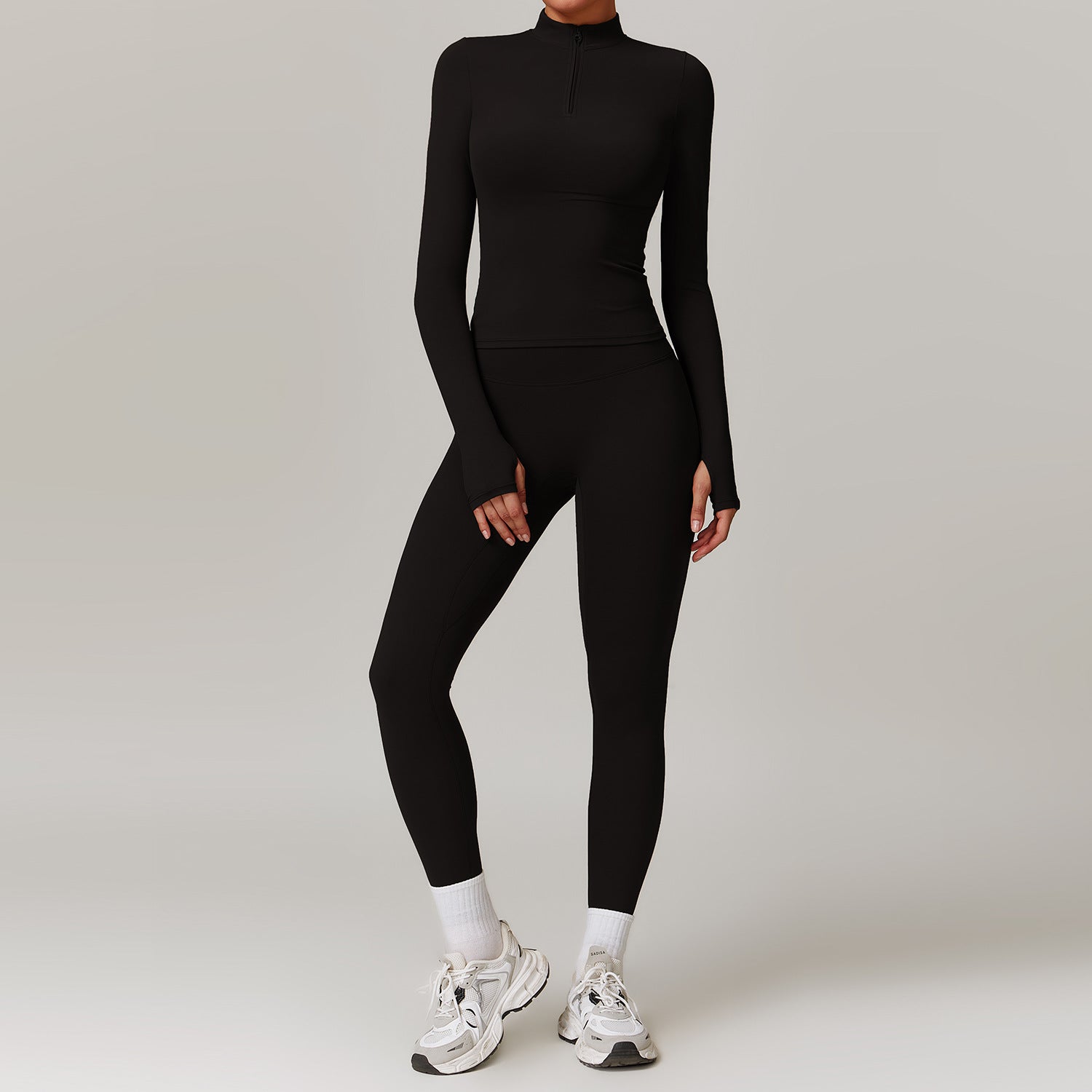 Black long-sleeved turtleneck bodysuit with leggings and white sneakers for outdoor fitness