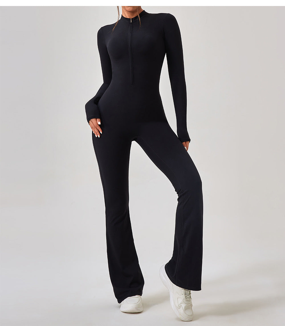 Black long-sleeved zip-up jumpsuit with flared legs and white sneakers in Comfy One Piece Sportswear