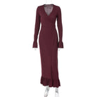 Burgundy knit maxi dress with ruffled hem and long sleeves for fashionable style