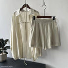 Cream-colored belted long sleeve sun protection shirt with matching shorts for spring