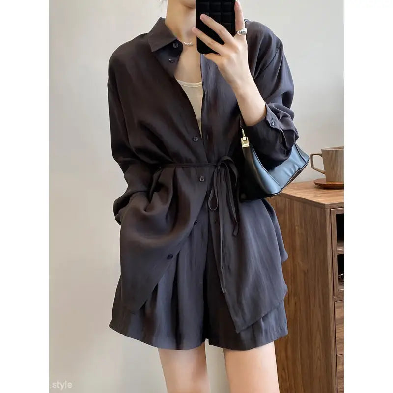 Black button-up shirt dress with waist tie, ideal breathable sun protection for spring and fall