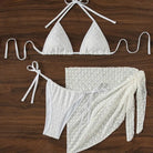 White lace bikini set with a matching wrap skirt.