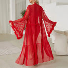 Red sheer robe with flared sleeves and feathered trim.