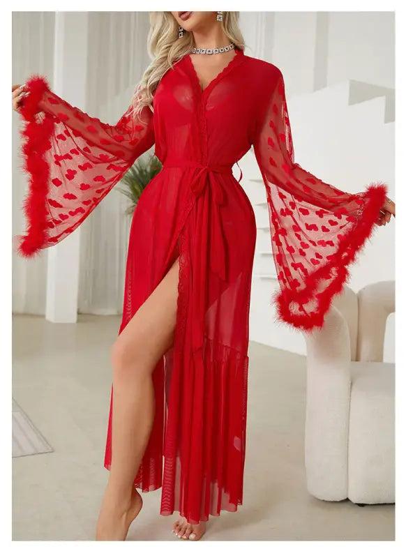 Vibrant red sheer robe with wide bell sleeves and feather trim.