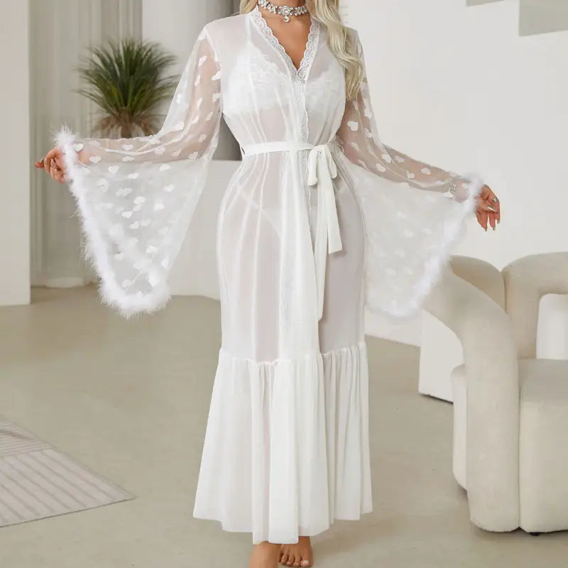 White sheer robe with bell sleeves and a tie waist.