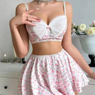 Floral print two-piece outfit with a white bralette top and matching skirt.