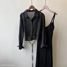 Black slip dress and cropped jacket on hangers in Sunrise Cardigan set for versatile wear