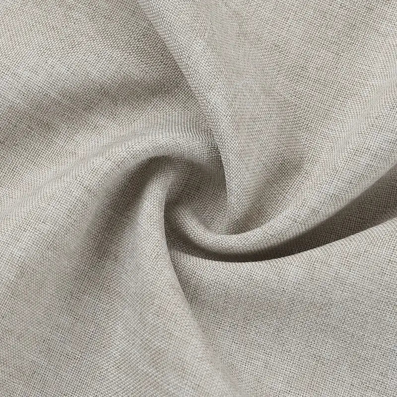 Twisted beige fabric with a visible weave texture.