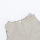 Light gray sleeveless top with a zipper closure at the back.