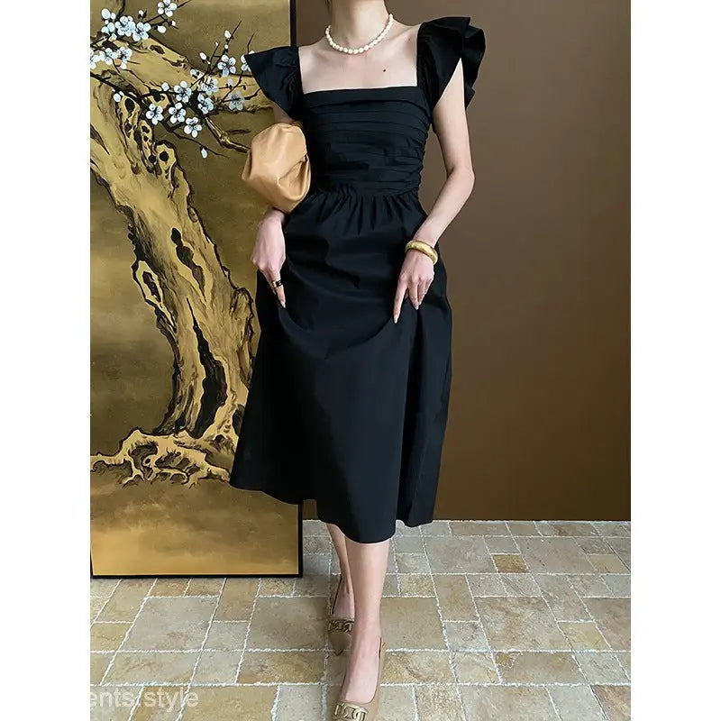 Elegant Flying Dress featuring a Black Midi with Ruffled Cotton and Butterfly Sleeves