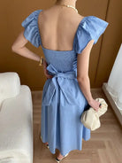 Light blue ruffled sleeve dress showcasing the Elegant Flying Dress design