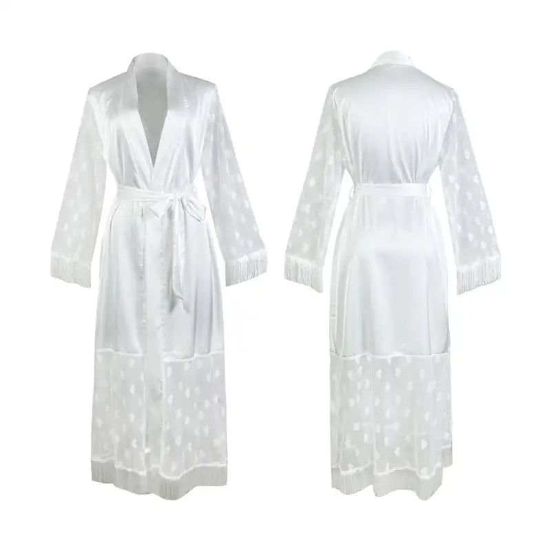 White, long-sleeved robe with a tie waist and sheer polka dot pattern on the lower half.