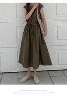 Olive green midi dress with cap sleeves and a drawstring waist.