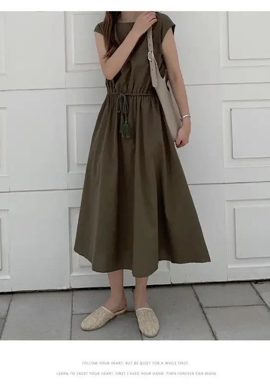 Olive green midi dress with cap sleeves and a drawstring waist.