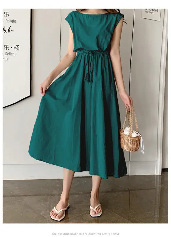 Emerald green sleeveless midi dress with a drawstring waist and flared skirt.