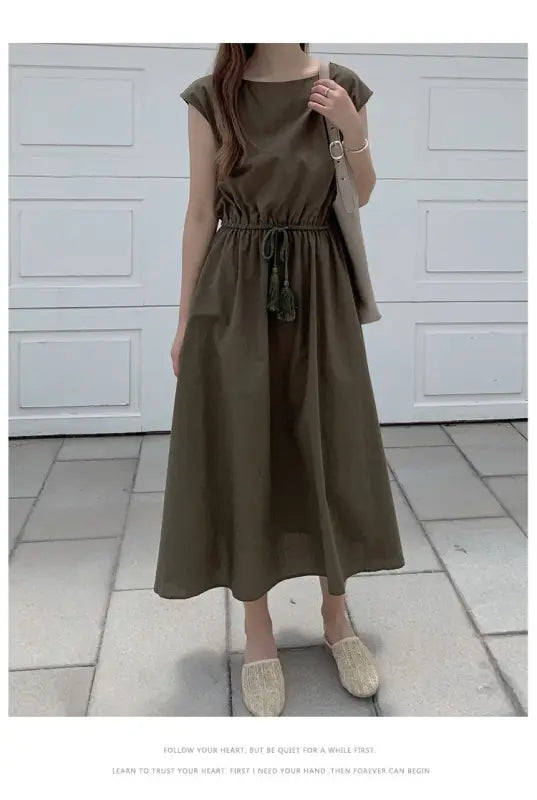 Olive green maxi dress with cap sleeves and a drawstring waist.