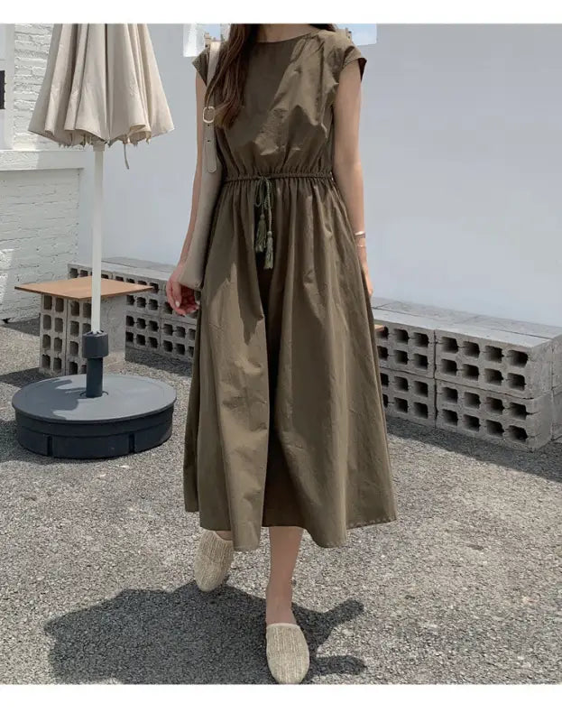 Olive green midi dress with a cinched waist and cap sleeves.