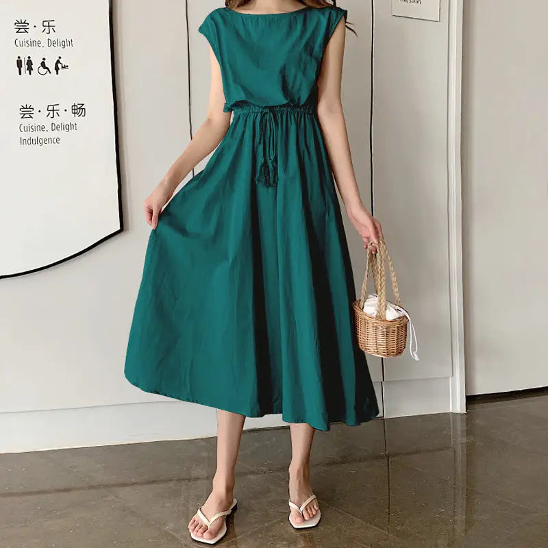 Emerald green sleeveless midi dress with a cinched waist and flared skirt.