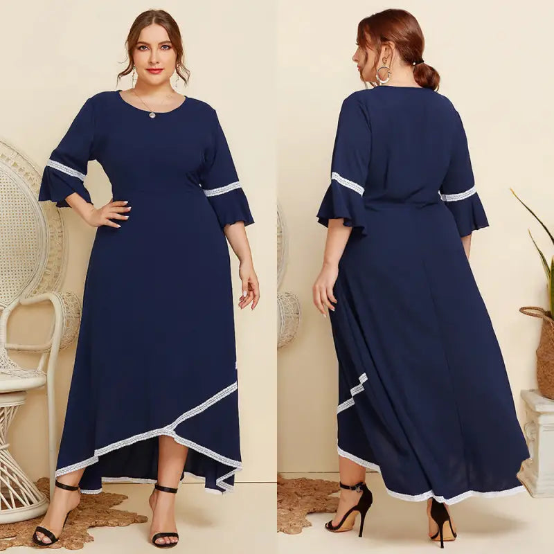 Navy blue maxi dress with white trim and flared sleeves.