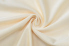 Swirled cream-colored fabric with soft folds and a silky texture.