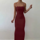 Burgundy floor-length bodycon dress with thin spaghetti straps.