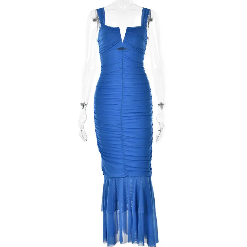 Blue form-fitting mermaid-style dress with ruched detailing and a sheer flared bottom.