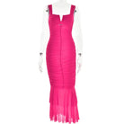 Bright pink form-fitting mermaid-style evening gown with ruched bodice and sheer flared bottom.