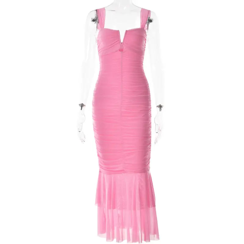 Pink form-fitting mermaid-style dress with ruched bodice and sheer flared bottom.