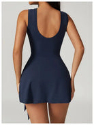 Navy blue sleeveless mini dress with a low-cut back.