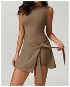 Sleeveless taupe mini dress with a wrap-style skirt and tie detail.