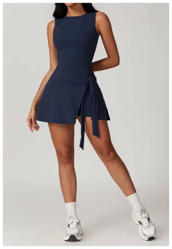 Navy blue sleeveless mini dress with a side tie detail.