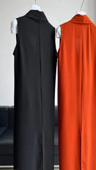 Two sleeveless, floor-length dresses with collars in black and orange.