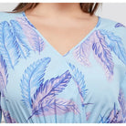 V-neck blouse with a blue and purple feather print pattern.