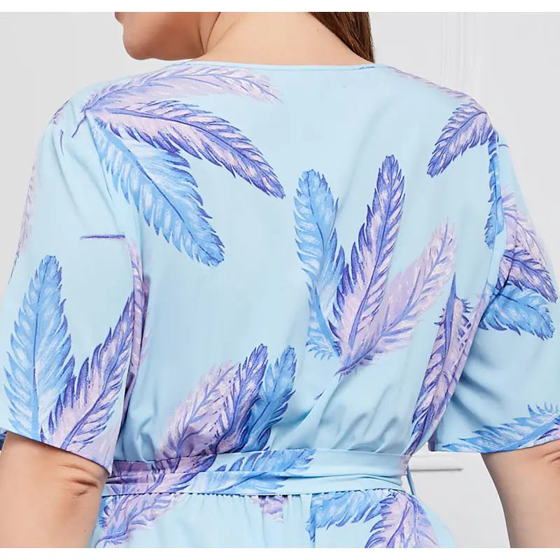 Light blue dress with a feather print pattern in shades of blue and purple.