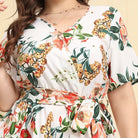 Floral-patterned wrap dress with short sleeves and a V-neckline.