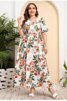 Floral print maxi dress with short sleeves and a belted waist.