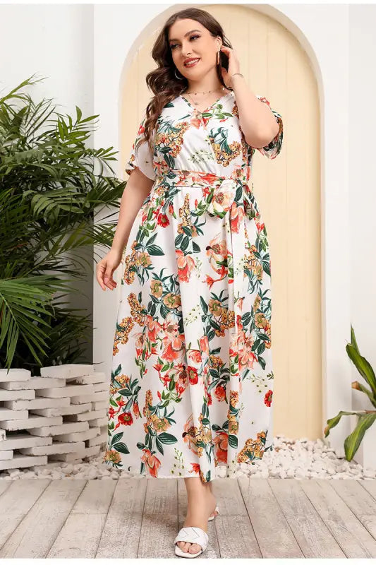 Floral print wrap dress with short sleeves and a belted waist.