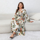 Floral print wrap dress with long sleeves and a belted waist.