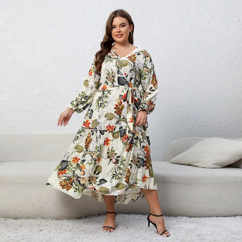 Floral print maxi dress with long sleeves and a ruffled hem.