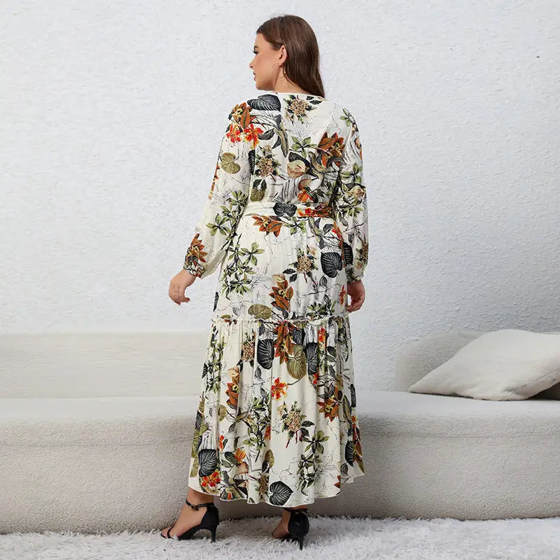 Long floral maxi dress with long sleeves and a ruffled hem.