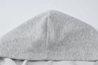 Gray fabric hood or cap with a seam down the center.