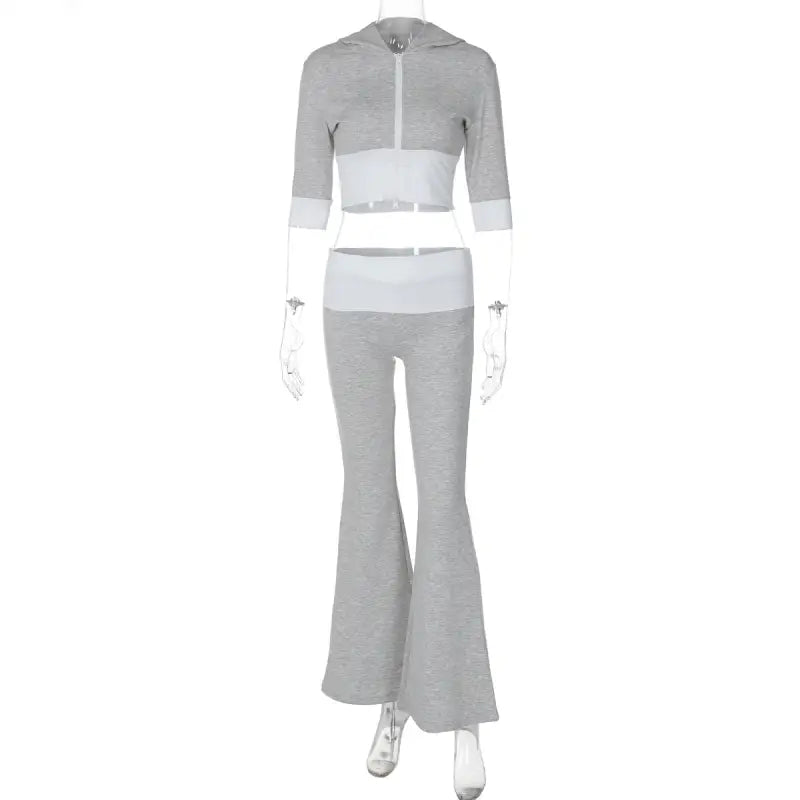 Gray and white two-piece outfit consisting of a cropped hoodie and flared pants.