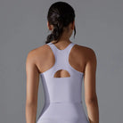 White racerback athletic top with a cutout detail on the back.