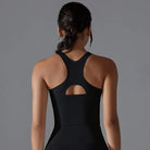 Black racerback athletic top with a cutout detail on the back.