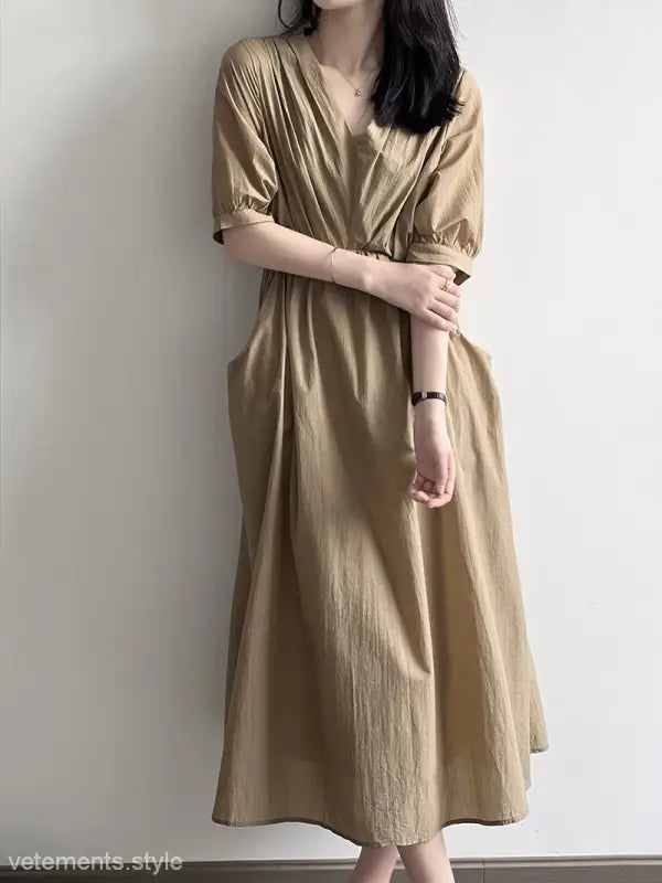 Beige flowy Retro V Neck Pleated Midi Dress with short sleeves and a V-neckline