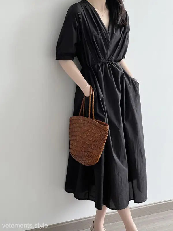 Black Retro V Neck Pleated Midi Dress with short sleeves and a cinched waist