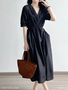 Black Retro V Neck Pleated Midi Dress featuring short sleeves and a cinched waist