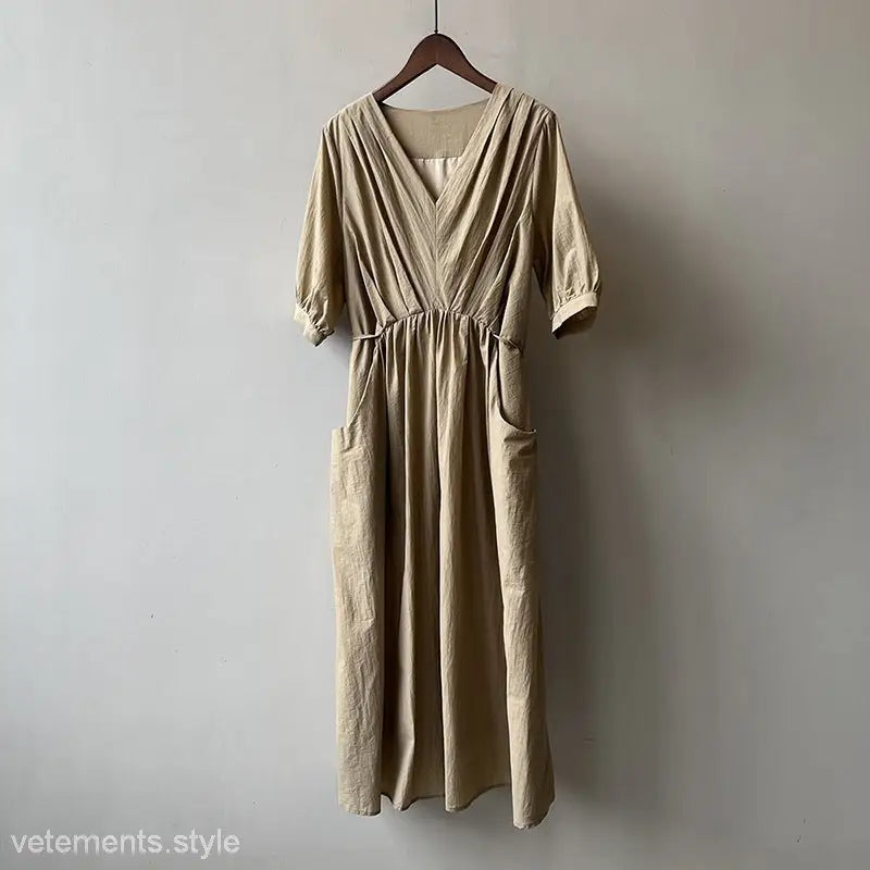 Beige Retro V Neck Pleated Dress with three-quarter sleeves and side pockets on hanger