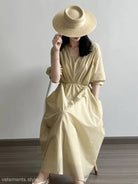 Pale yellow Retro V Neck Pleated Midi Dress with cinched waist and straw hat